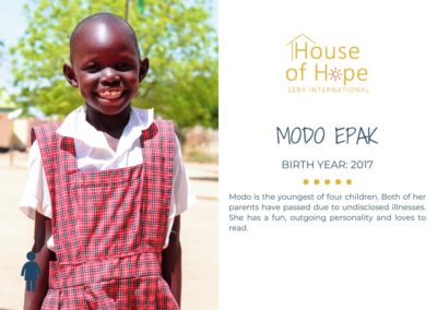 Portrait of Modo Epak, born in 2017, standing outside and wearing a colorful dress. The image includes text about her background and challenges, presented by House of Hope SERV International.